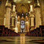 brown wooden chairs inside cathedral